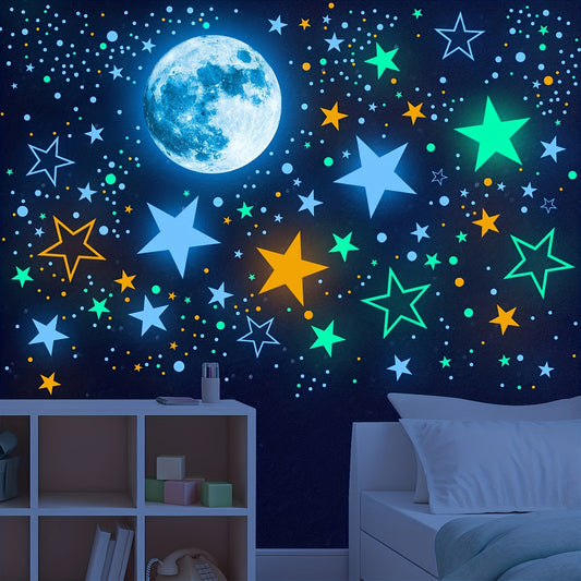 Glowing blue moon and multicolored star wall stickers arranged above a white bed and shelf in a dark room.