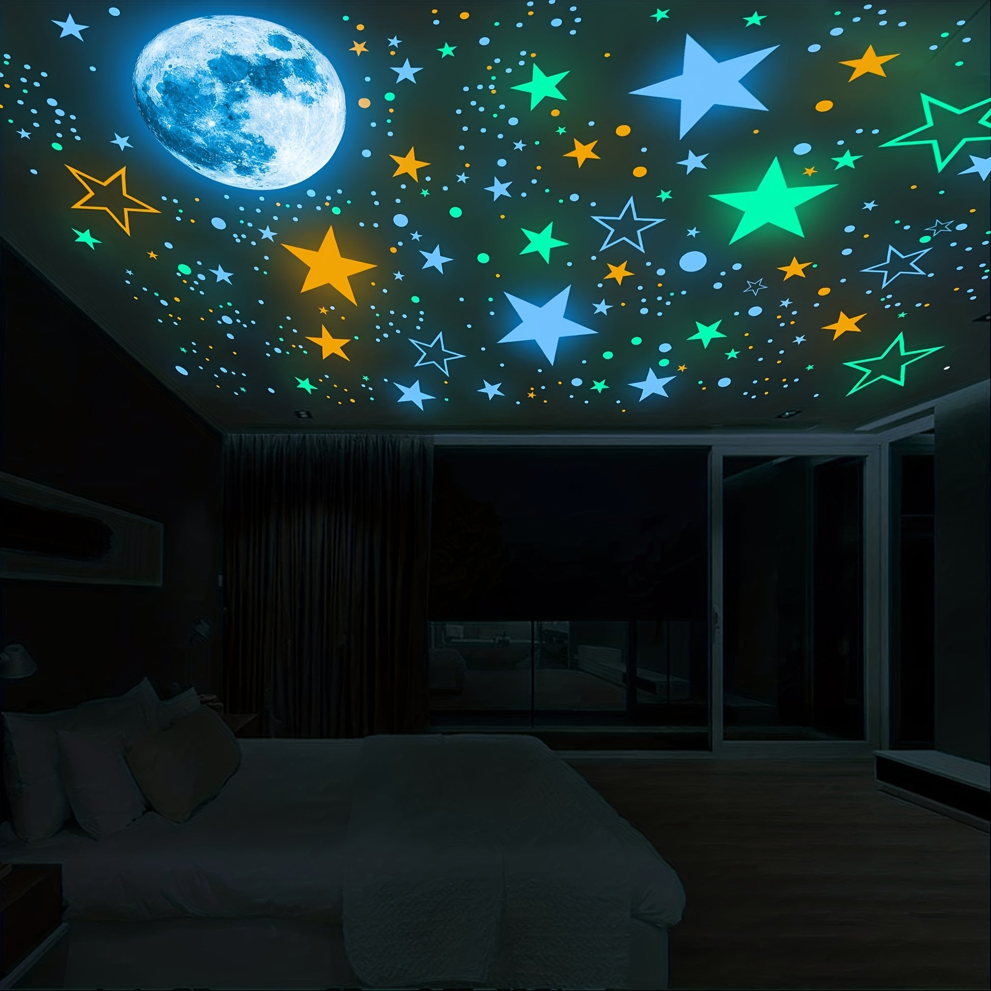 Glow in the dark moon and star stickers in blue, green, and orange applied to a dark bedroom ceiling.